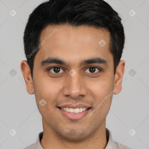 Joyful latino young-adult male with short  brown hair and brown eyes