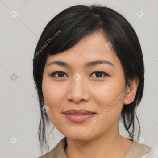 Joyful asian young-adult female with medium  black hair and brown eyes