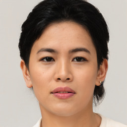 Joyful asian young-adult female with short  black hair and brown eyes