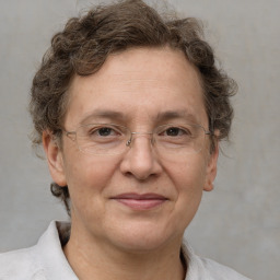 Joyful white adult male with short  brown hair and grey eyes