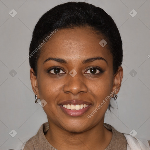 Joyful black young-adult female with short  black hair and brown eyes