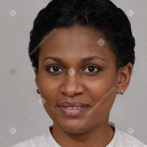 Joyful black adult female with short  brown hair and brown eyes