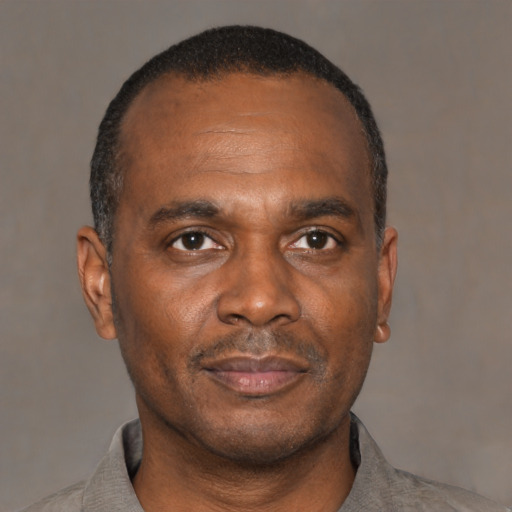 Neutral black adult male with short  black hair and brown eyes