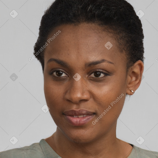 Joyful black young-adult female with short  brown hair and brown eyes