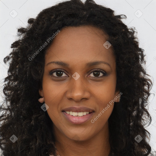 Joyful black young-adult female with long  brown hair and brown eyes