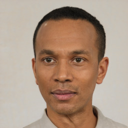 Neutral black adult male with short  black hair and brown eyes