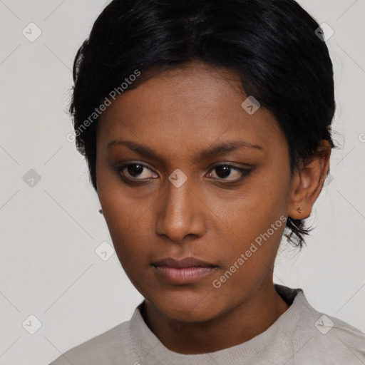 Neutral black young-adult female with short  black hair and brown eyes