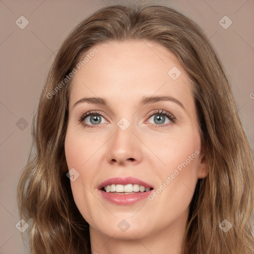 Joyful white young-adult female with medium  brown hair and green eyes