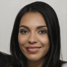 Joyful latino young-adult female with long  black hair and brown eyes