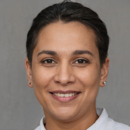 Joyful white adult female with short  brown hair and brown eyes