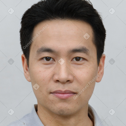 Neutral asian young-adult male with short  brown hair and brown eyes