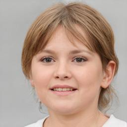 Joyful white child female with medium  brown hair and grey eyes