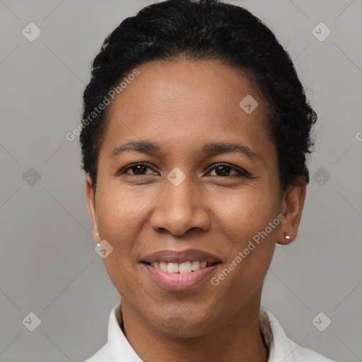 Joyful latino young-adult female with short  black hair and brown eyes