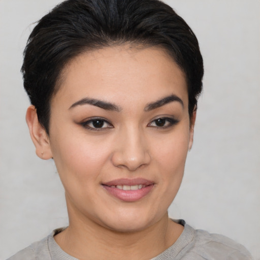 Joyful asian young-adult female with short  brown hair and brown eyes