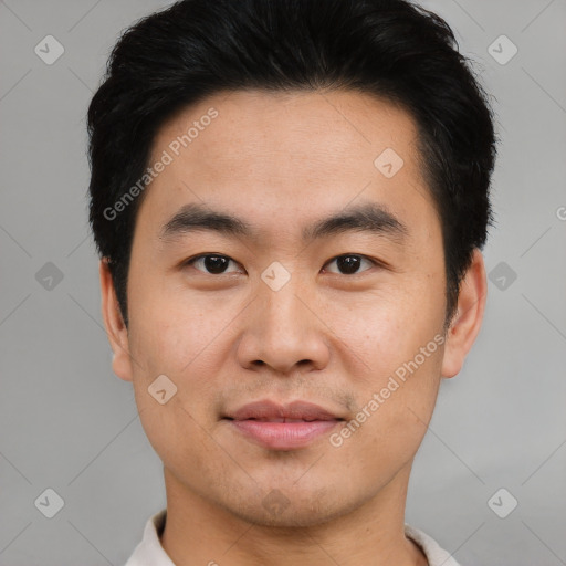 Joyful asian young-adult male with short  black hair and brown eyes