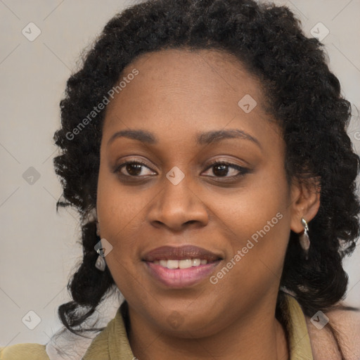 Joyful black young-adult female with long  brown hair and brown eyes