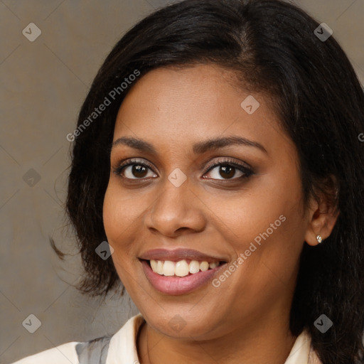 Joyful black young-adult female with medium  brown hair and brown eyes