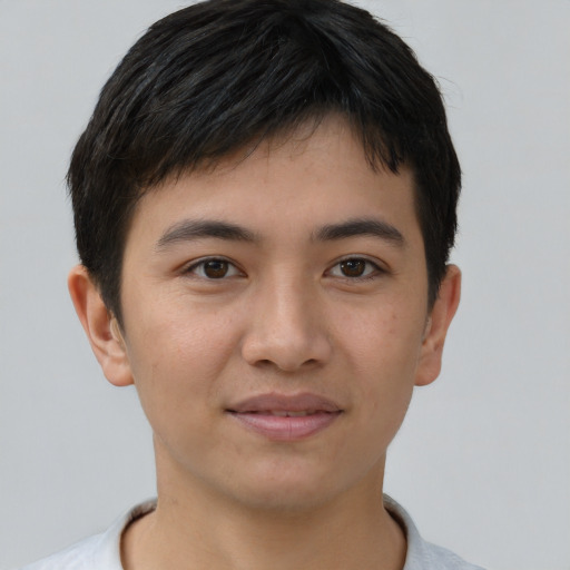 Joyful asian young-adult male with short  brown hair and brown eyes