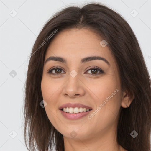 Joyful white young-adult female with long  brown hair and brown eyes