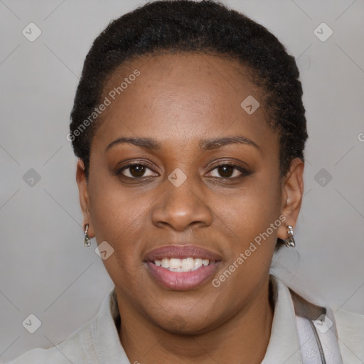 Joyful black young-adult female with short  brown hair and brown eyes