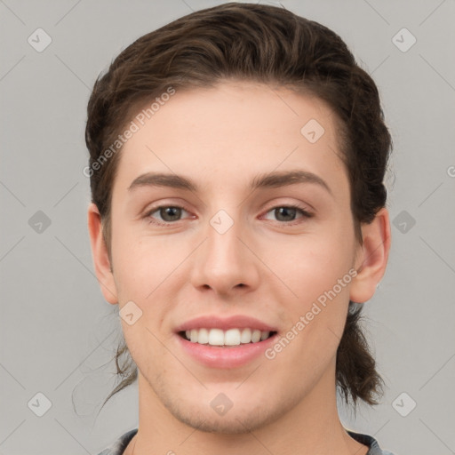 Joyful white young-adult female with short  brown hair and grey eyes