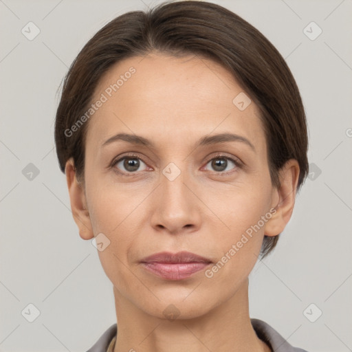 Joyful white adult female with short  brown hair and brown eyes