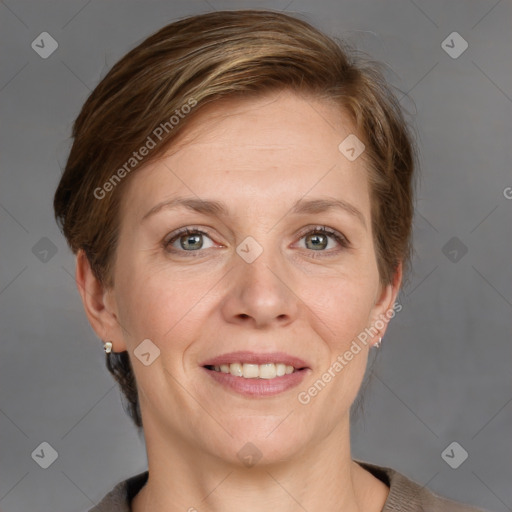 Joyful white adult female with medium  brown hair and grey eyes