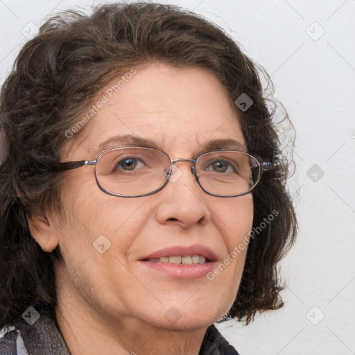 Joyful white adult female with medium  brown hair and blue eyes