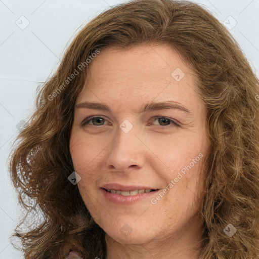 Joyful white young-adult female with long  brown hair and green eyes