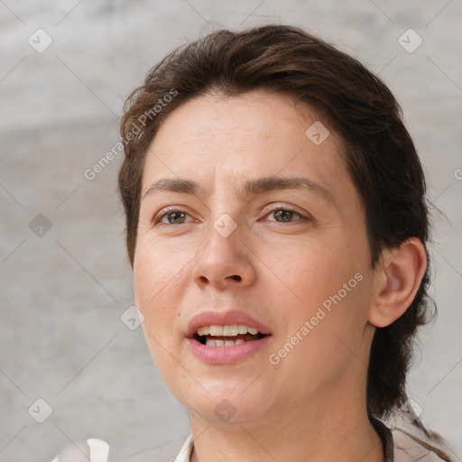 Joyful white adult female with short  brown hair and brown eyes