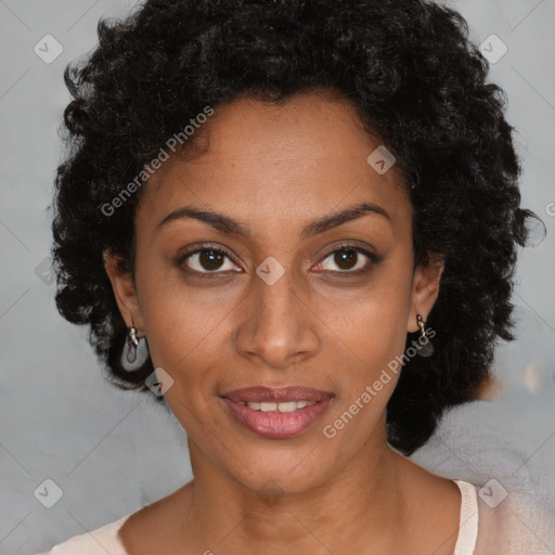 Joyful black young-adult female with short  black hair and brown eyes