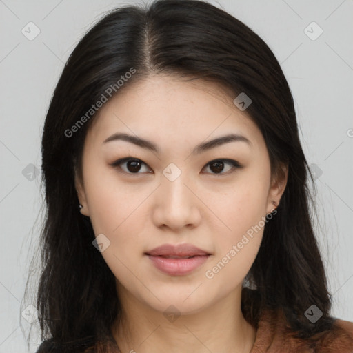 Joyful asian young-adult female with long  brown hair and brown eyes