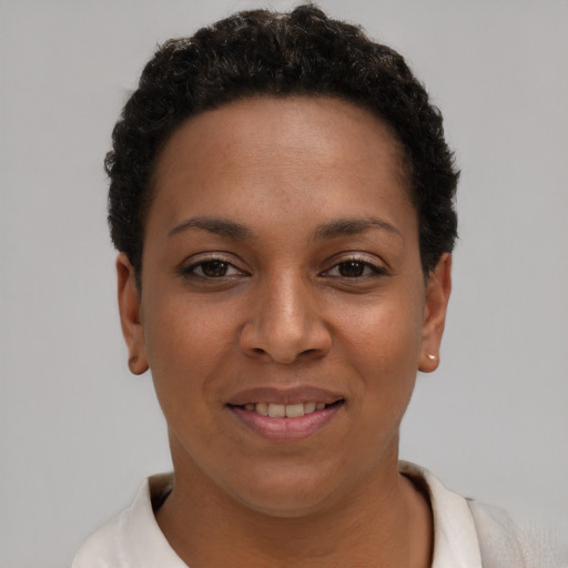 Joyful latino young-adult female with short  brown hair and brown eyes