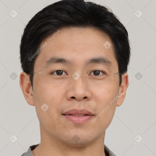 Joyful asian young-adult male with short  brown hair and brown eyes