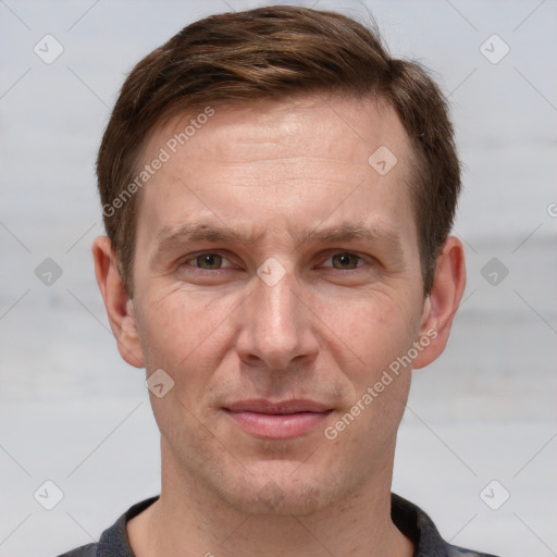 Joyful white adult male with short  brown hair and grey eyes