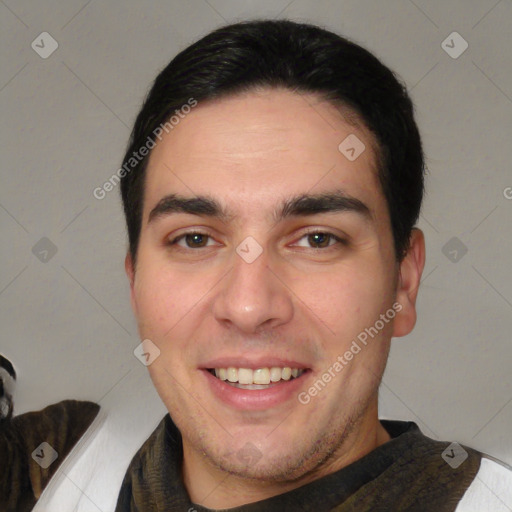 Joyful white young-adult male with short  black hair and brown eyes