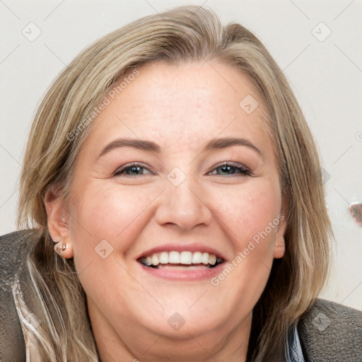 Joyful white young-adult female with medium  brown hair and blue eyes