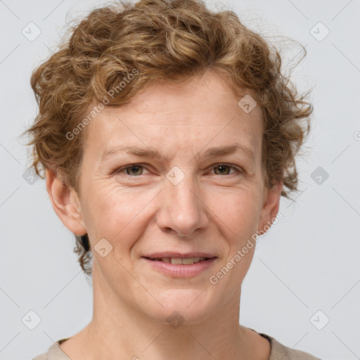 Joyful white adult female with short  brown hair and grey eyes