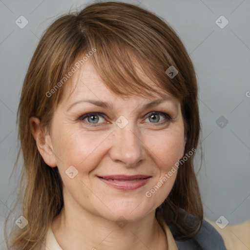 Joyful white adult female with medium  brown hair and grey eyes