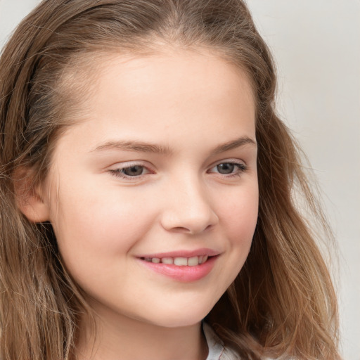 Joyful white child female with long  brown hair and brown eyes