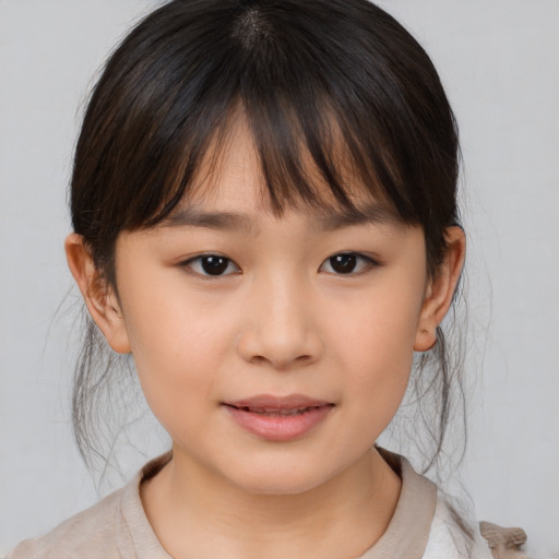 Joyful asian child female with medium  brown hair and brown eyes