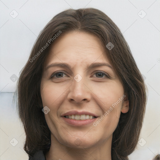 Joyful white adult female with medium  brown hair and brown eyes