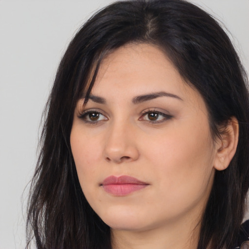 Joyful white young-adult female with long  black hair and brown eyes