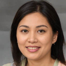 Joyful white young-adult female with medium  brown hair and brown eyes