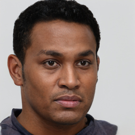 Neutral black young-adult male with short  black hair and brown eyes
