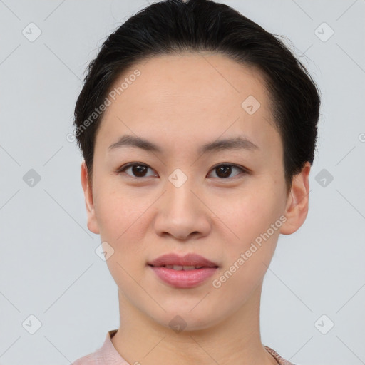 Joyful asian young-adult female with short  brown hair and brown eyes