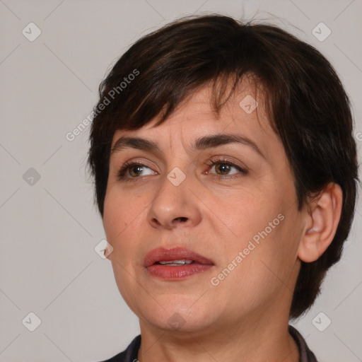 Joyful white adult female with medium  brown hair and brown eyes