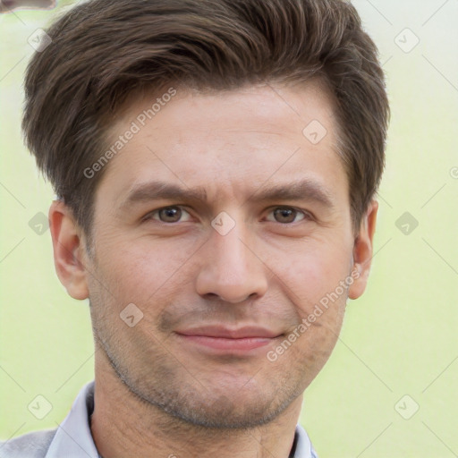 Joyful white adult male with short  brown hair and brown eyes