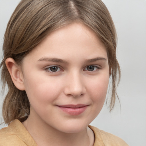 Joyful white child female with medium  brown hair and brown eyes