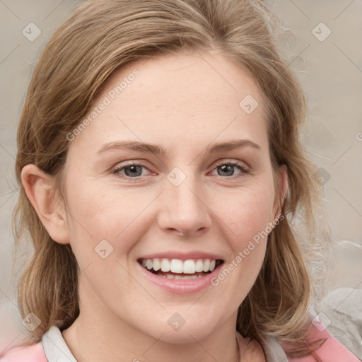 Joyful white young-adult female with medium  brown hair and blue eyes